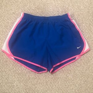 Blue and pink girl’s Nike running shorts